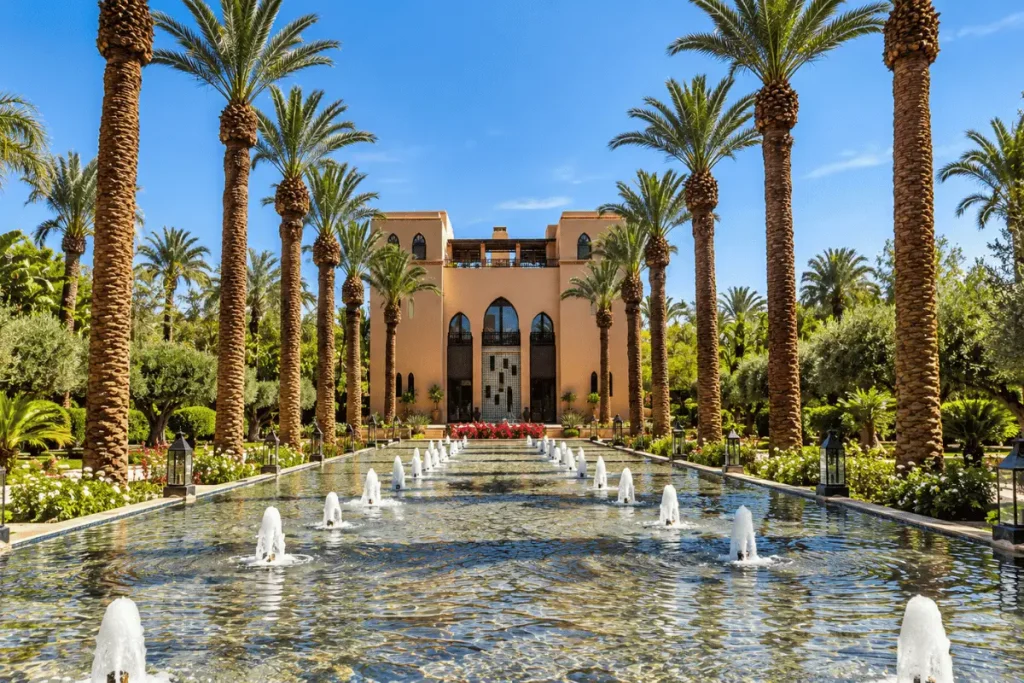 Swimming pool surrounded by gardens at Four Seasons Resort Marrakech.
