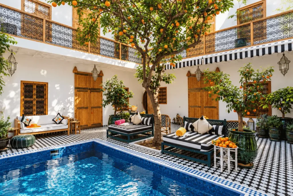 Blue zellige-tiled courtyard plunge pool at Riad Botanica in Marrakech.