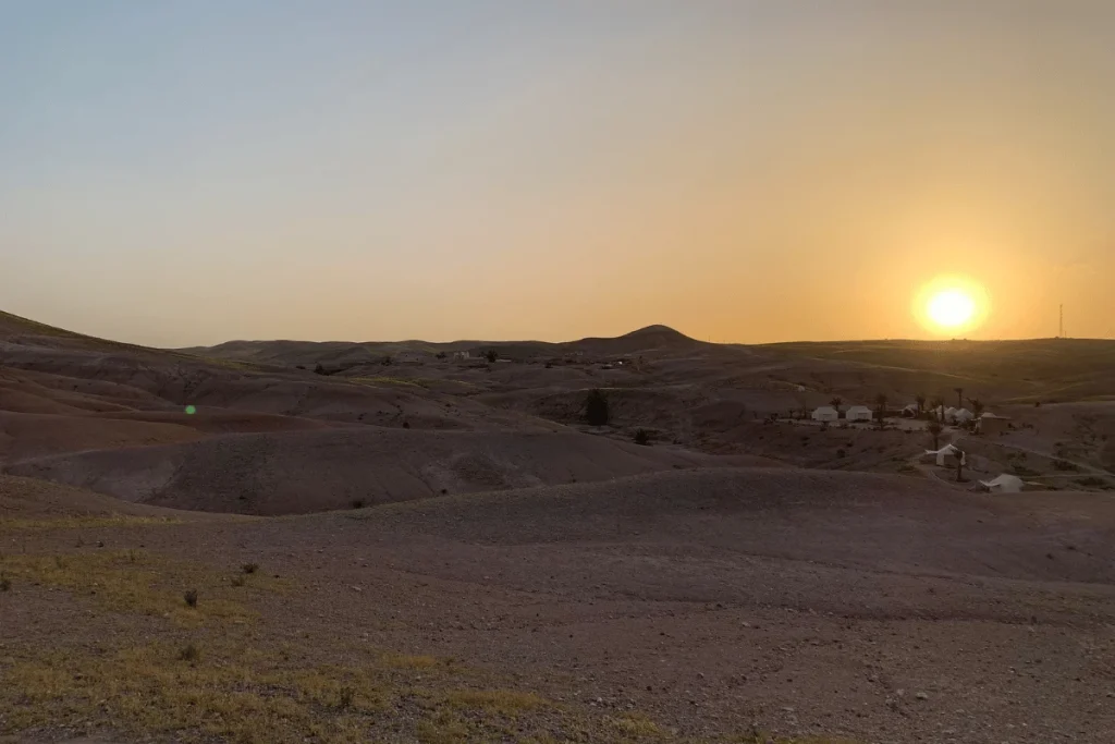 Sunset over the rocky landscape of Agafay Desert near Marrakech