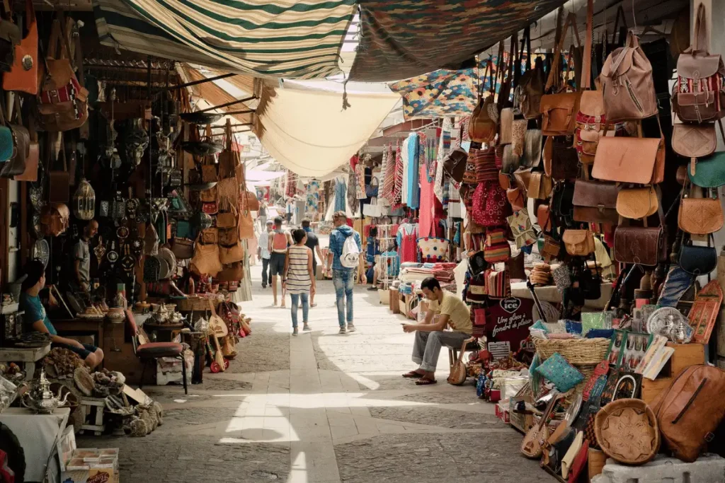 Visitors exploring the traditional souks and narrow streets of Marrakech's medina